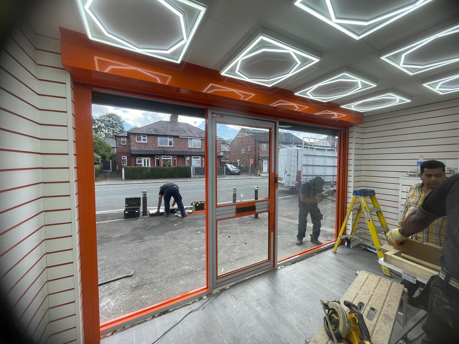 Fire exit door with push-bar hardware fitted to rear of premises