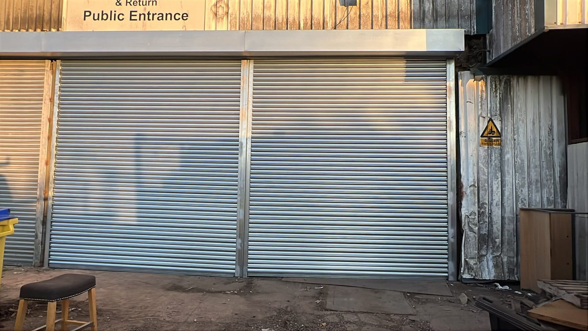 Steel roller shutter installation on commercial premises